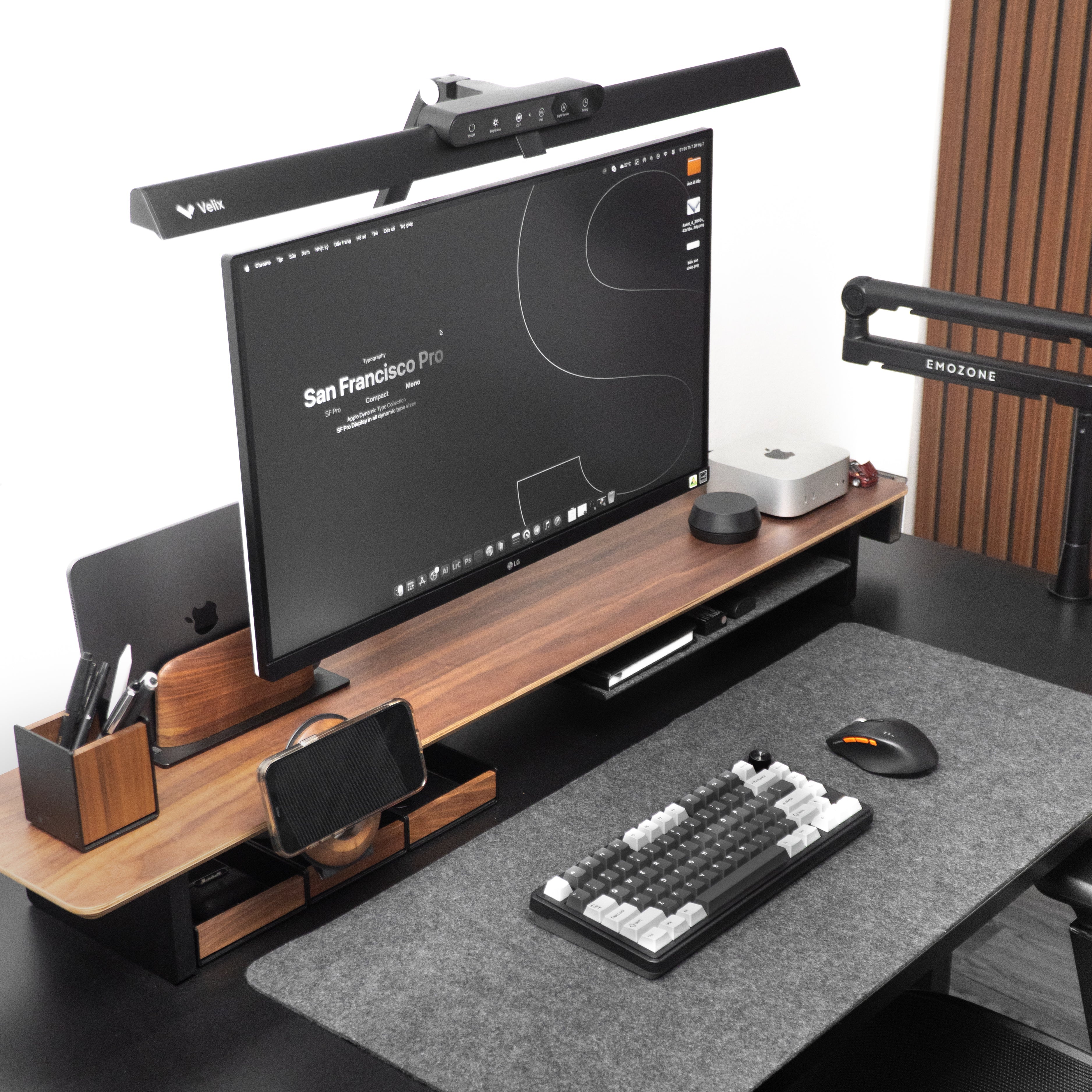 Modern office desk setup with computer monitor, keyboard, and chair.